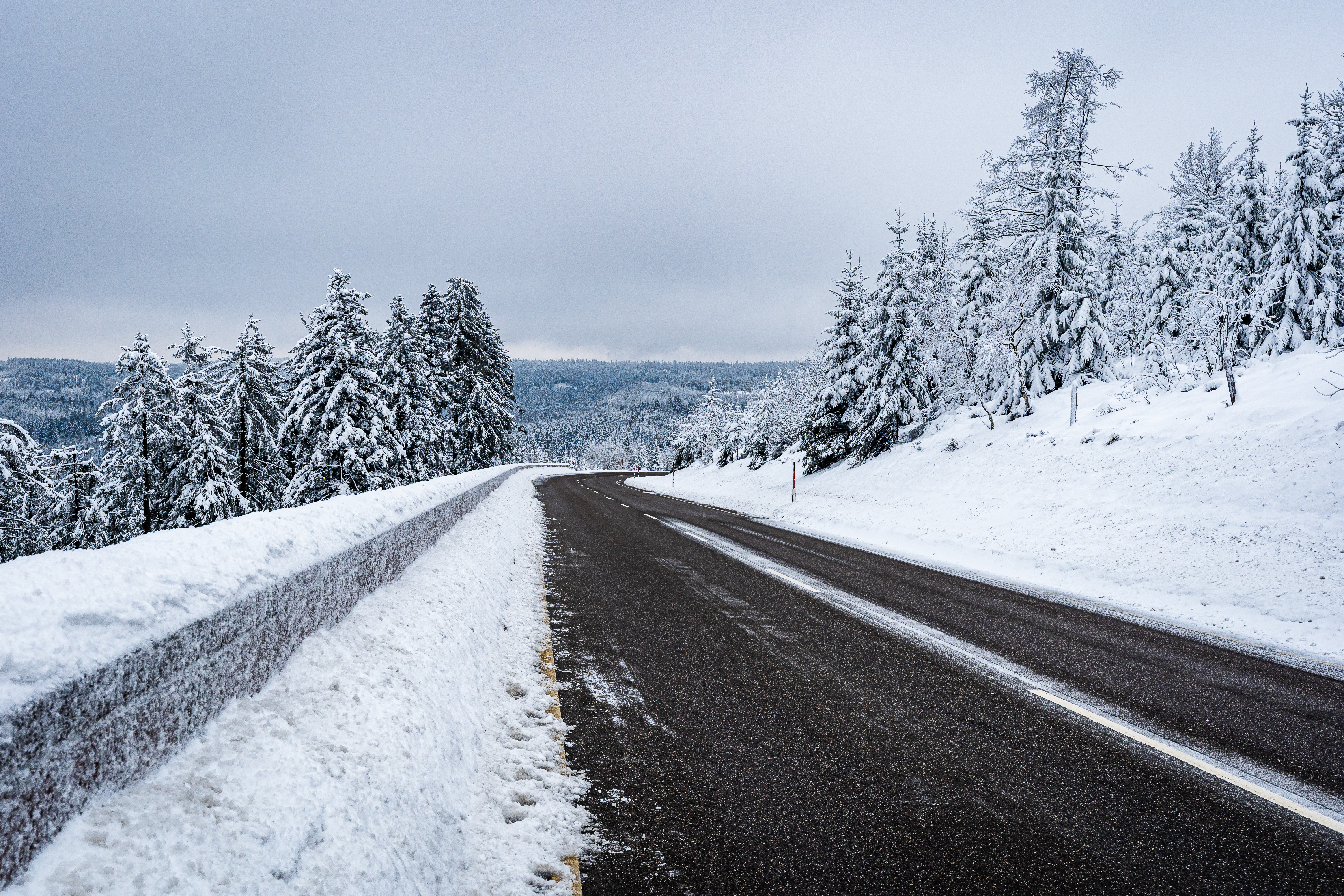 Closeup shot of a road in the Black Forest Mountains, Germany in winter Closeup shot of a road in the Black Forest Mountains, Germany in winter